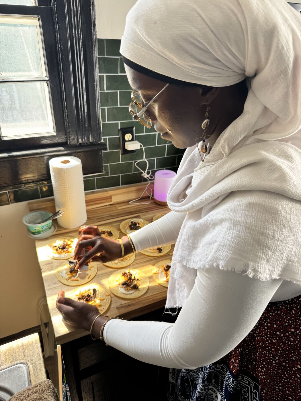 Little Lights preparing a plant-based meal in the kitchen